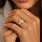 Close-up of a hand wearing a diamond ring with a neutral background