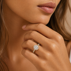 Close-up of a hand wearing a diamond ring with a blurred background