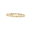 Gold bracelet with diamond accents on a white background