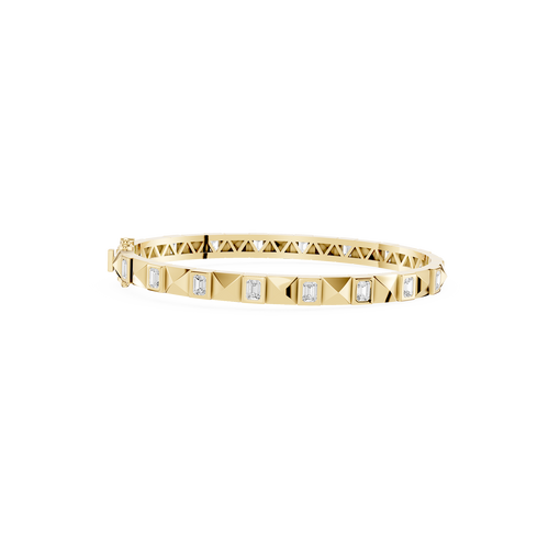 Gold bracelet with diamond accents on a white background
