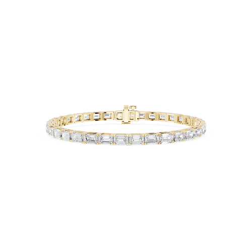 Gold bracelet with clear stones on a white background