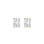 Pair of emerald-cut diamond stud earrings on a white background