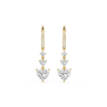 Gold and diamond earrings on a white background
