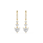 Gold and diamond earrings on a white background