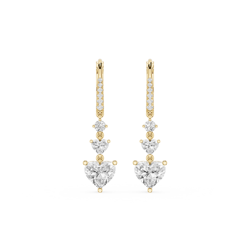 Gold and diamond earrings on a white background