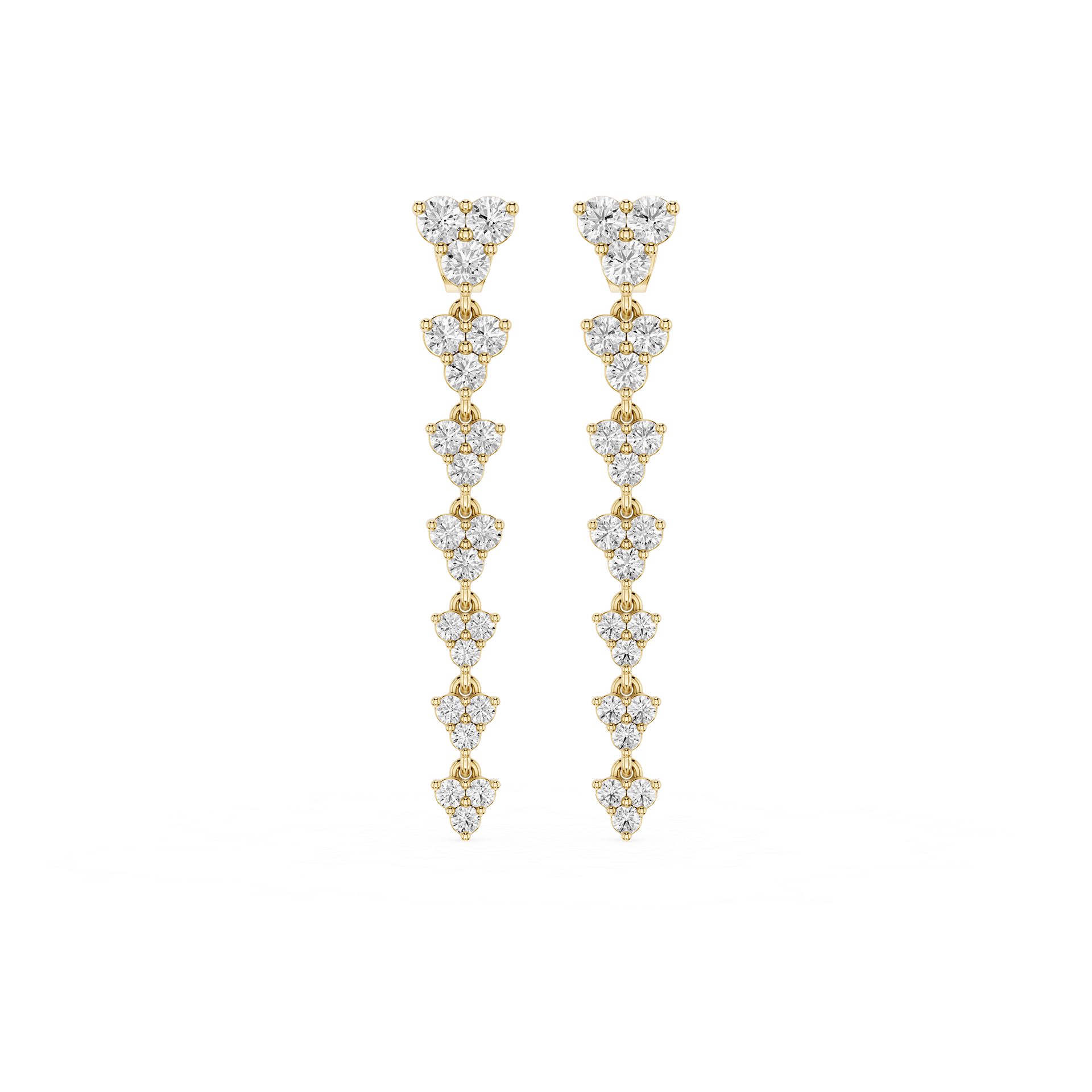 Gold and diamond earrings on a white background