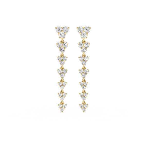 Gold and diamond earrings on a white background