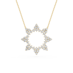 Diamond necklace with a star-shaped pendant on a gold chain against a white background