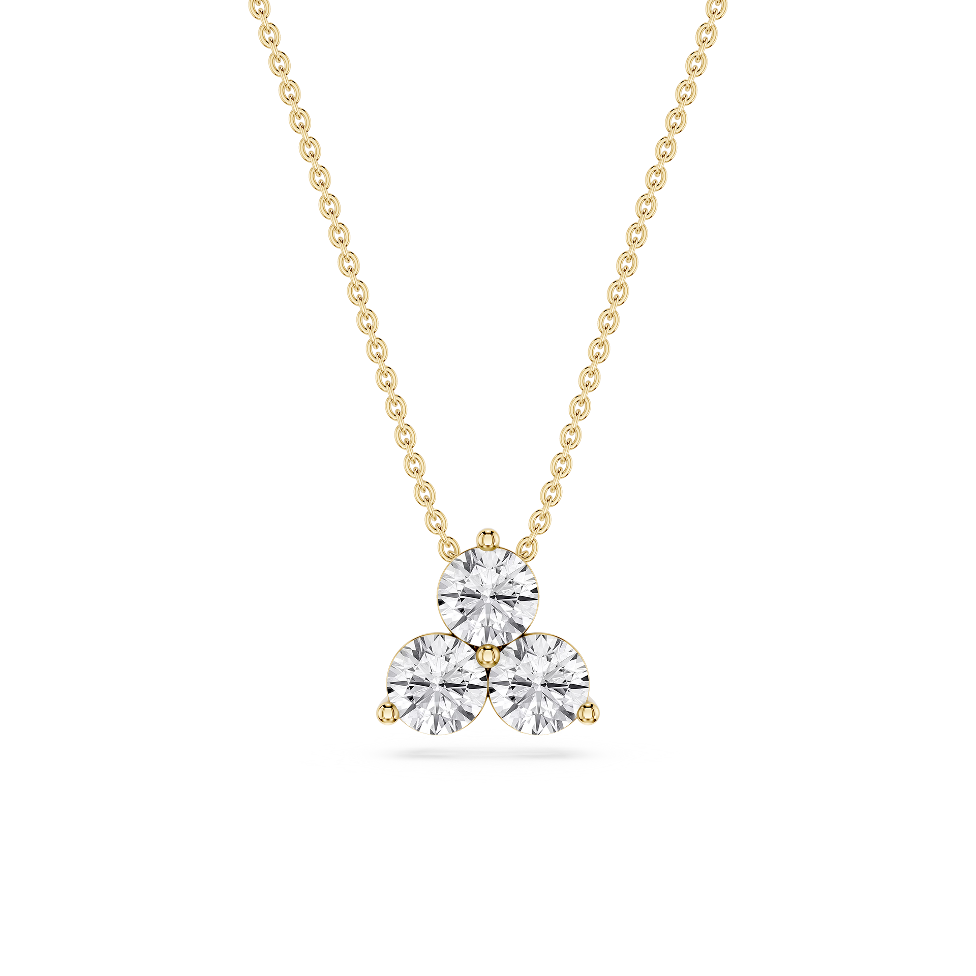 Gold necklace with a heart-shaped diamond pendant on a white background