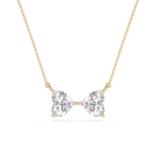 Diamond necklace with bow design on a white background