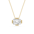 Gold necklace with a clear gemstone pendant on a white background