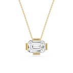 Gold necklace with a clear gemstone pendant on a white background