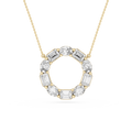 Gold necklace with a circular pendant featuring emerald-cut diamonds on a white background