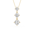 Three-tier diamond pendant on a gold chain against a white background
