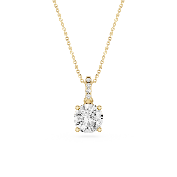 A yellow gold necklace with a round-cut clear gemstone pendant and a small diamond channel accent on the bail, shown against a plain white background.