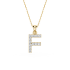 A gold initial pendant necklace featuring the letter 'F' paved with small clear stones, suspended from a delicate gold chain on a white background.