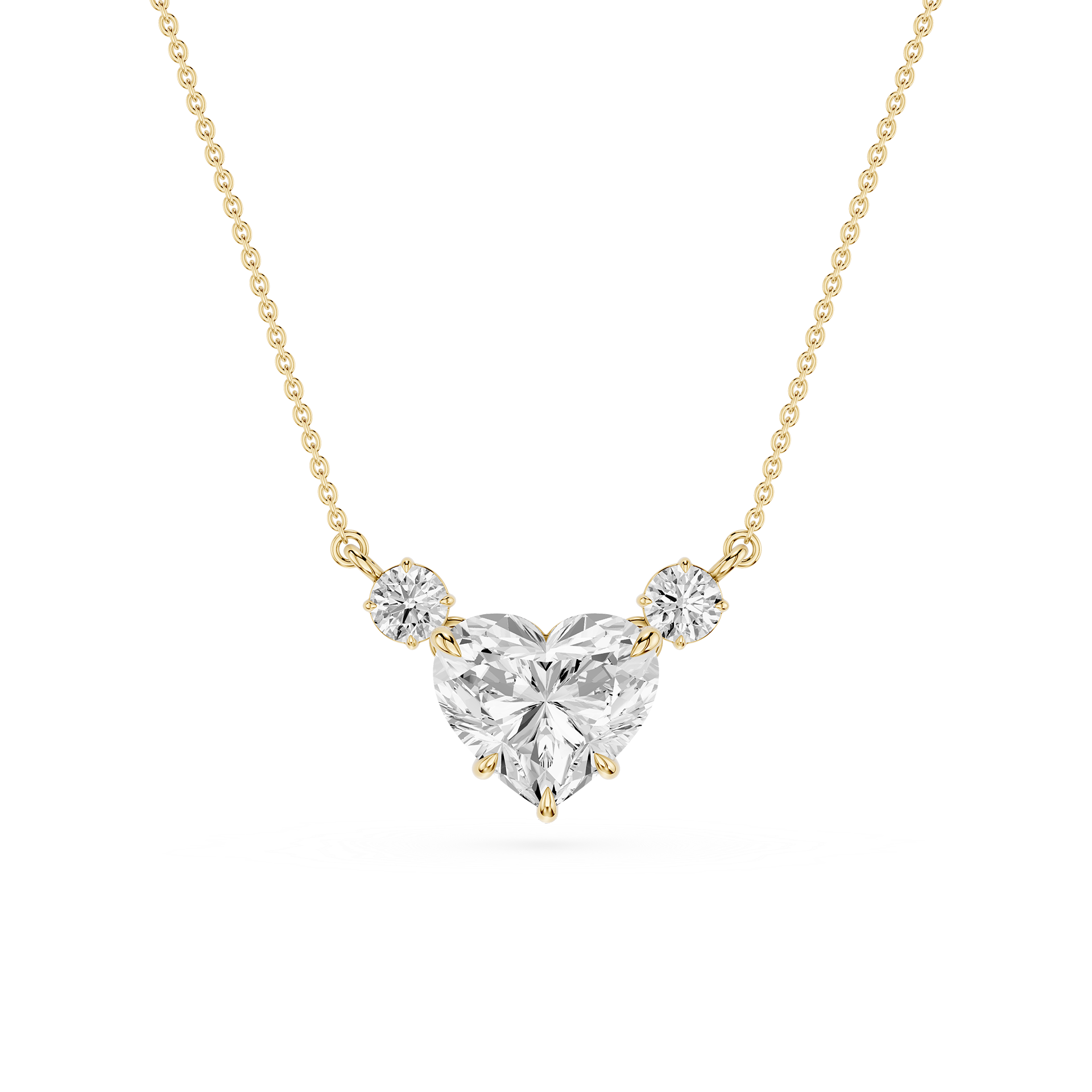 A yellow gold necklace featuring a heart-shaped diamond pendant with two smaller round diamonds on either side, set against a plain white background.