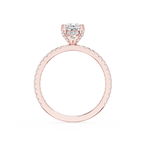 Rose gold ring with diamond accents on a white background