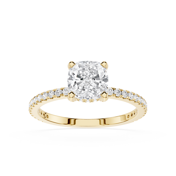 Gold ring with a large diamond and smaller diamonds on the band against a white background