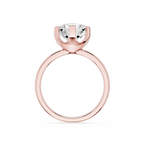 Gold ring with a clear gemstone on a white background