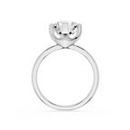 Gold ring with a clear gemstone on a white background