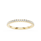 Gold ring with small diamonds on a white background