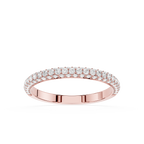 Gold ring with diamond accents on a white background