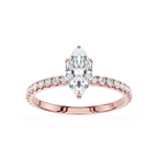Gold ring with a Marquise -shaped diamond and smaller diamonds on a white background