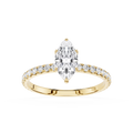 Gold ring with a marquise shaped diamond and smaller diamonds on a white background