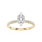 Gold ring with a marquise shaped diamond and smaller diamonds on a white background