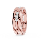 Rose gold ring with embedded diamonds on a white background