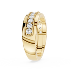 Gold ring with diamond accents on a white background