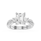 Diamond ring with emerald-cut center stone on a white background