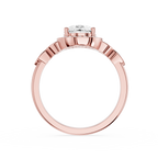 Rose gold ring with a diamond on a white background