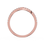 Rose gold ring with small diamonds on a white background