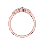 Rose gold ring with diamonds on a white background