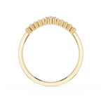 Gold ring with small diamonds on a white background