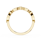 Gold ring with a geometric design on a white background