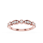 Rose gold ring with diamonds on a white background