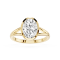 Gold ring with a large diamond on a white background