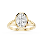 Gold ring with a large diamond on a white background
