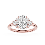 Rose gold ring with a large central diamond and smaller diamonds on the sides on a white background