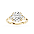 Gold ring with a large central diamond and smaller diamonds on the sides on a white background