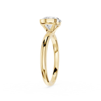 Gold ring with a diamond on a white background