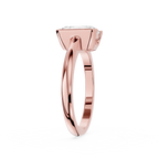 Rose gold ring with a diamond on a white background