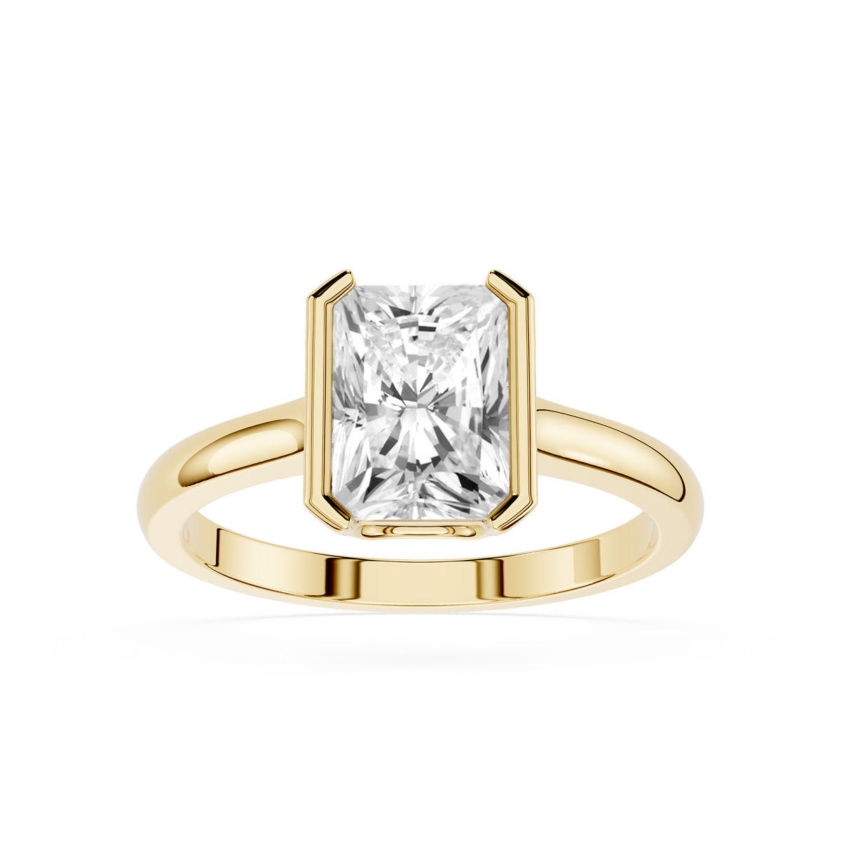 Women's engagement ring in open bezel gold setting with a radiant cut lab-grown diamond.