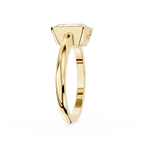 Gold ring with a diamond on a white background