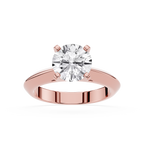 Rose gold ring with a large diamond on a white background