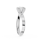 Silver ring with a diamond on a white background