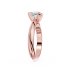 Rose gold ring with a diamond on a white background
